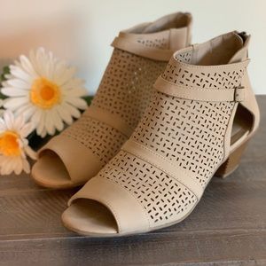 Tan heeled sandals with zip up heel.